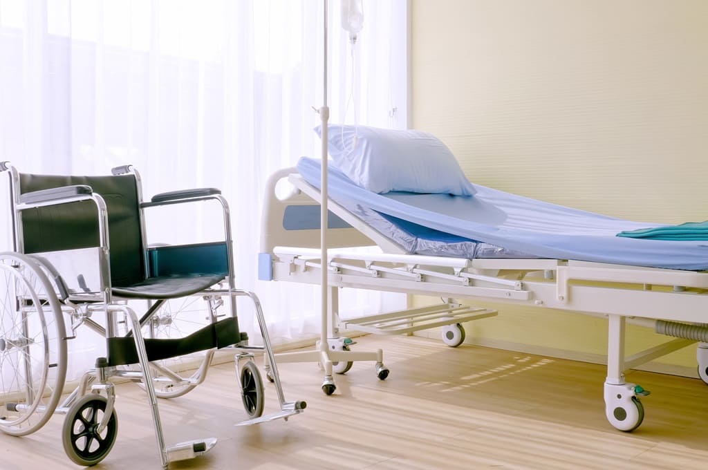 hospital_Por rthanuthattaphong_ENVATO_HN_hospital-bed-and-wheelchair-at-hospital-room-2023-11-27-05-12-20-utc